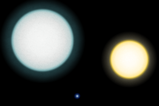 A comparison between the white dwarf IK Pegasi B (center), its A-class companion IK Pegasi A (left) and the Sun (right). This white dwarf has a surface temperature of 35,500 K.