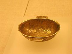 A Chinese Tang Dynasty (618&ndash;907 CE) gilt-silver cup with flower design