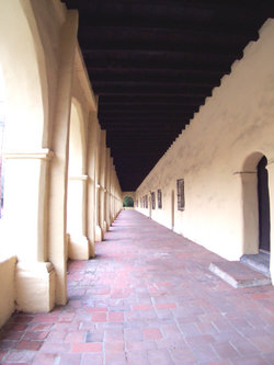 A view looking down a typical exterior corridor at Mission San Fernando Rey de Espa&ntilde;a.