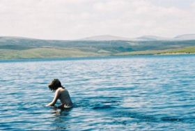 Cow Green Reservoir, with (l to r) Great Dun Fell, Little Dun Fell and Cross Fell in the background at a distance of about 10&nbsp;km