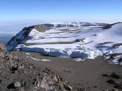 Furtw&auml;ngler Glacier atop Kilimanjaro in the foreground and snowfields and the Northern Icefields beyond.