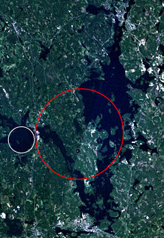 Keurusselk&auml; - Landsat 7 image of the Keurusselk&auml; region. Area where shatter cones have been found is marked with a red ellipse and the suggested impact structure of Ukonselk&auml; is marked with a white circle.