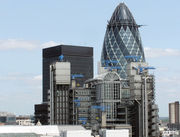 Lloyd’s Building, London (with the blue cranes). The Gherkin shaped Swiss Re Tower is in the background