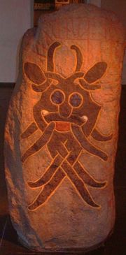 The iconic late Viking Age Mask Stone found in Aarhus, housed at the Moesg&aring;rd Museum.