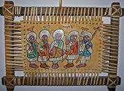 This leather painting depicts Ethiopian Orthodox priests playing sistra and a drum.