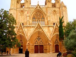 The Lala Mustafa Pasha Mosque in Famagusta (Gazimağusa). Formerly &Tau;he Saint Nicolas Cathedral prior to its conversion in 1571. Tourism remains an important source of revenue for Northern Cyprus.
