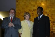 Pel&eacute;, right, with Brazil President Luiz In&aacute;cio Lula da Silva, left, and First Lady Marisa, July 13, 2004.