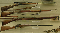 A collection of rifles from the Fram museum, a civilian Krag-J&oslash;rgensen M1894 with a carved stock on top.