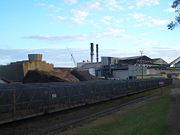 Sugarcane trains on 2-foot narrow gauge tracks in front of Proserpine Sugar Mill in Proserpine, Queensland
