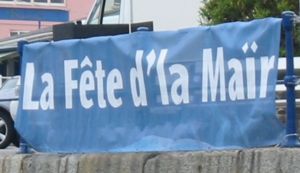 Dg&egrave;rn&eacute;siais (Guernsey) being used to advertise a sea festival