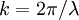 k = 2\pi / \lambda\;