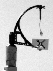 Phoenix deployed and then imaged the MET weather mast that holds the wind-strength and direction-measuring telltale at a height of 2.3&nbsp;m. This enhanced image shows wind from the northeast on Sol 3.