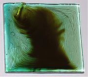 Failed laboratory glass melting test. The striations must be avoided through good homogenization.