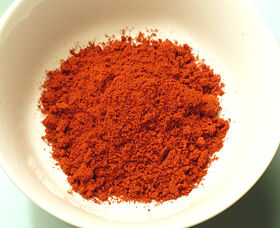 A small bowl of hot smoked Spanish paprika