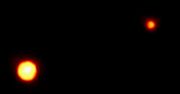 A telescopic image of Pluto and Charon.