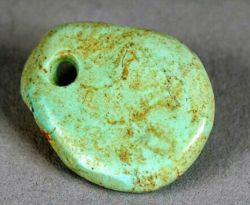 Trade in turquoise crafts, such as this freeform pendant dating from 1000&ndash;1040 CE, is believed to have brought the Ancestral Puebloans of the Chaco Canyon great wealth.