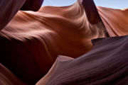 Lower Antelope Canyon was carved out of the surrounding sandstone by both mechanical weathering and chemical weathering. Wind, sand, and water from flash flooding are the primary weathering agents.